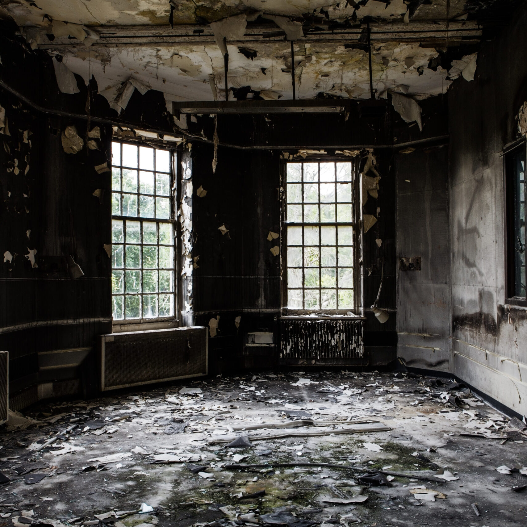 inside view of a deserted run down building after a fire